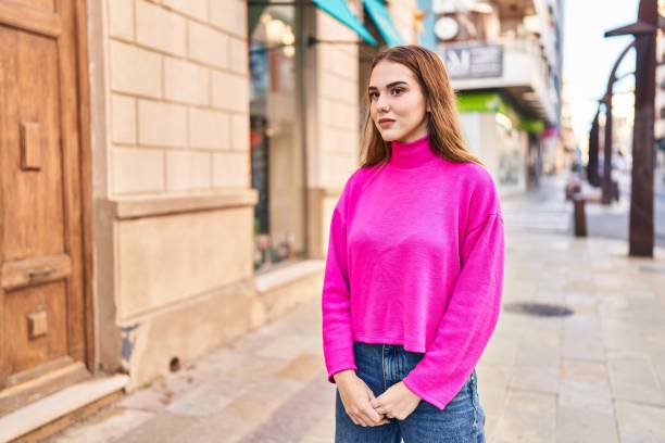 istock Young woman with relaxed expression standing at street 1437888828