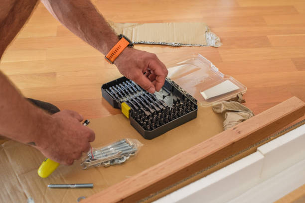 istock Closeup shot of a handyman picking a screw from a toolbox 1437889506