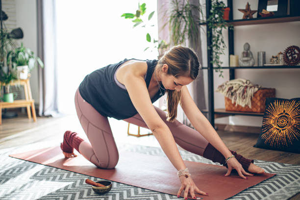 istock Doing yoga at home 1437894175