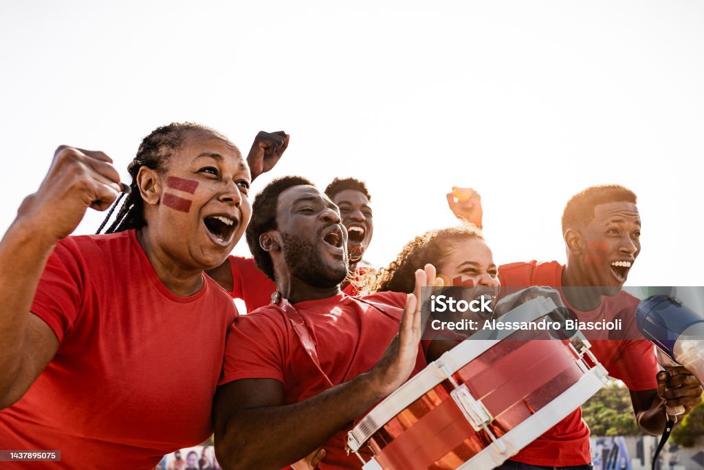 African football fans having fun cheering their favorite team - Soccer sport entertainment concept Fan - Enthusiast Stock Photo