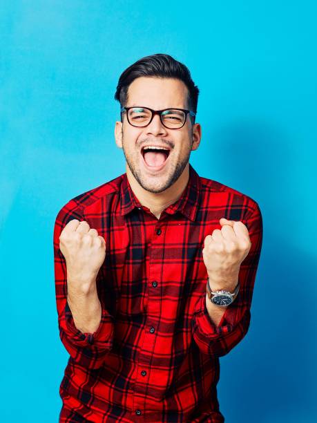 istock young man boy portrait face blue background 1437896385