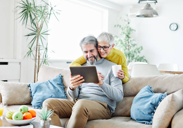 istock senior couple happy tablet computer love together 1437896587