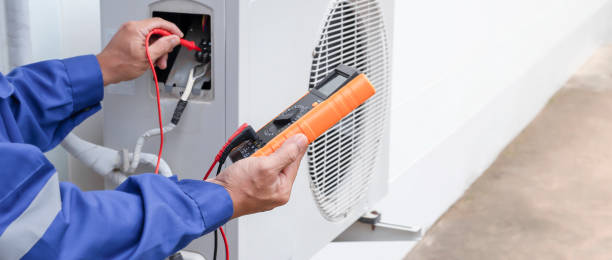 istock Air conditioner technician repairing central air conditioning system with outdoor tools 1437896628