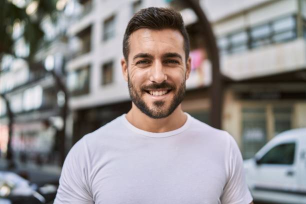 istock Young hispanic man smiling confident walking at street 1437896629