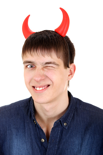 Sly Teenager with Devil Horns on the Head Isolated on the White Background