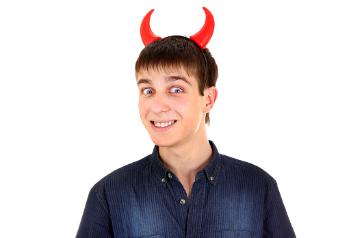 Sly Young Man with Devil Horns on the Head Isolated