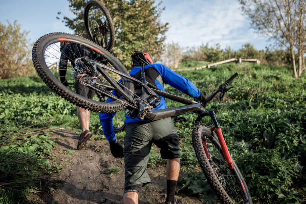 istock Two black mountain bikers on the trail 1437897230