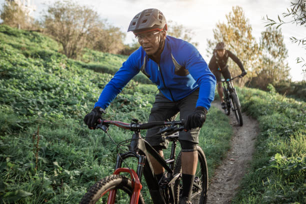 istock Two black mountain bikers on the trail 1437897252