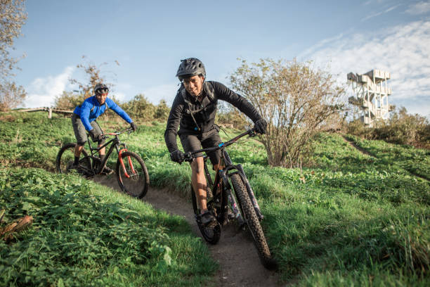 istock Two black mountain bikers on the trail 1437897427