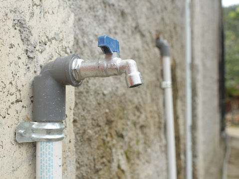 water faucet with paralon pipe in the yard of the house. water doesn't flow