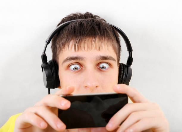 istock Surprised Teenager with Cellphone 1437898897