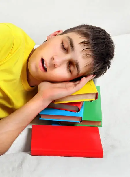 Teenager sleep with the Books on the Bed