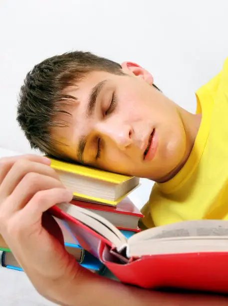 Teenager sleep with the Books on the Bed