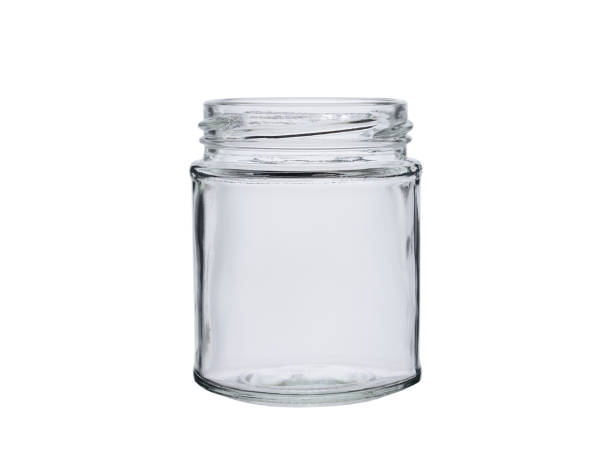 istock Open empty glass jar for food and drinks. Isolated on a white background. 1437901159