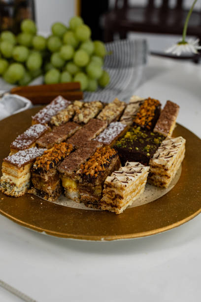 istock Assorted homemade cakes stage with grapes and nuts. 1437901490