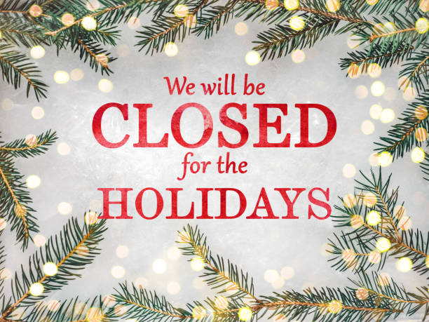 We will be closed for the Holidays We will be closed for the Holidays. Beautiful signboard for Christmas and New Year holidays. Colorful Christmas balls on the background of the Christmas tree. Closeup, top view. Holidays concept closed stock pictures, royalty-free photos & images