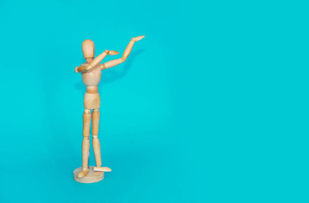 istock yellow wooden mannequin shows hand gestures on  blue background 1437901512