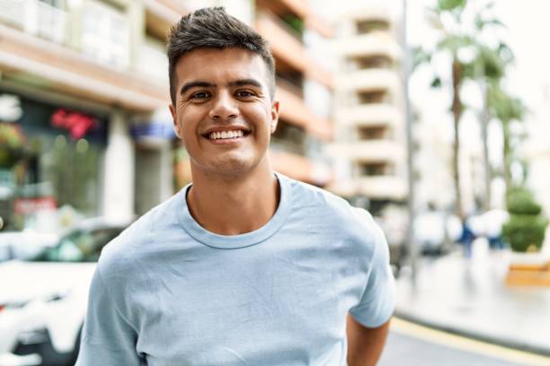 istock Young hispanic man smiling confident standing at street 1437901722