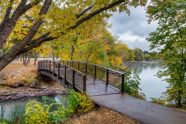 Walking bridge in autumn over Lake Nokomis in Minneapolis, Minnesota.