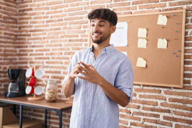 istock Young arab man business worker smiling confident speaking at office 1437907549