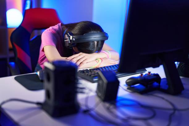 istock Young chinese woman streamer stressed using computer at gaming room 1437908937