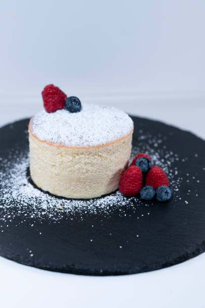 istock japanese cheese cake blueberry raspberry black plate sugar powder 1437910938
