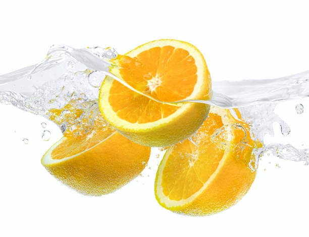 istock Oranges falling in water with splash on white background 1437911184