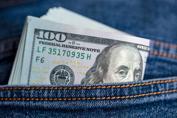 istock Dollar bills in jeans pocket 1437914630