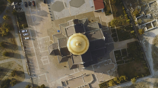 Top view on great christian church with golden dome. Shot. The dome of the Church in the center of the screen.