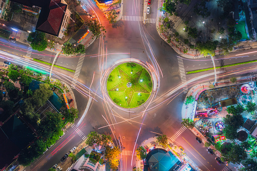 Drone view of traffic move around a traffic circle name 