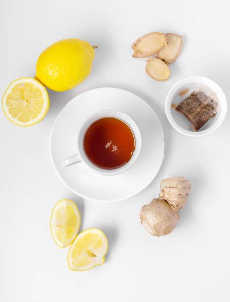 istock A cup of fresh tea with lemon and ginger. White background, isolated white. Top view. Copy space. 1437924192