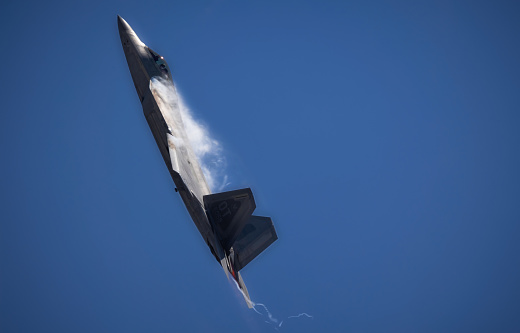 Miramar, California, USA - September 25, 2022: A US Air Force F-22 Raptor starts a sudden climb into the skies over the 2022 Miramar Airshow.