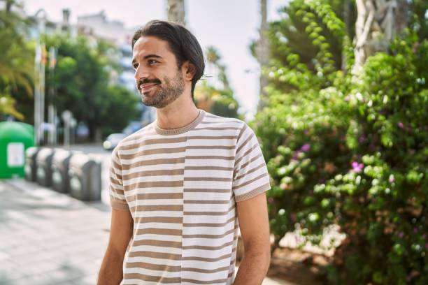 istock Young hispanic man smiling confident at park 1437925224