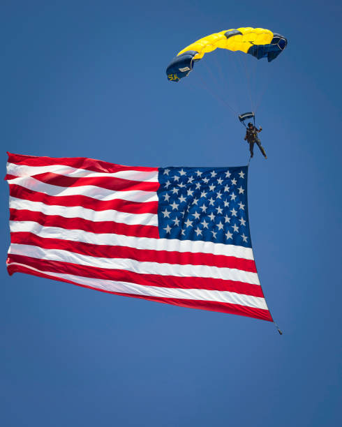 Leap Frog 4 Miramar, California, USA - September 23, 2022: A member of the US Navy Leap Frogs parachute team brings the American flag to the 2022 Miramar Airshow. miramar air show stock pictures, royalty-free photos & images