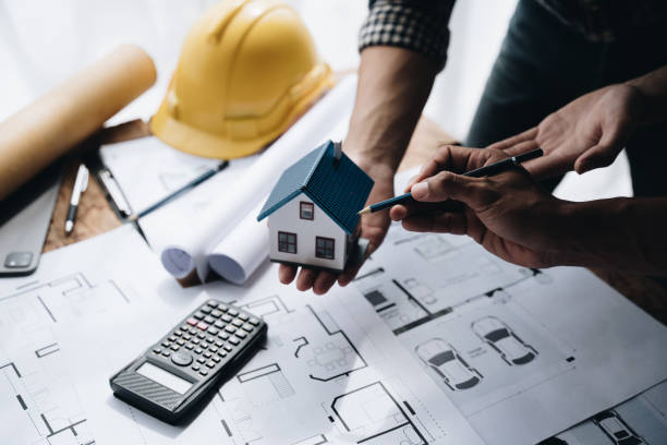 istock Confident team of engineers working together in a architect studio. 1437926206