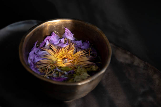 istock Herbal tea in rustic tea cup on Black background 1437927584