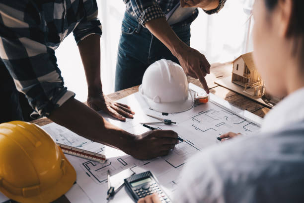 istock Architect concept, Architects working with blueprints in the office, Vintage Effect 1437928066