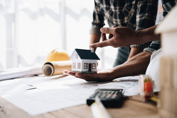 istock Confident team of engineers working together in a architect studio. 1437928516