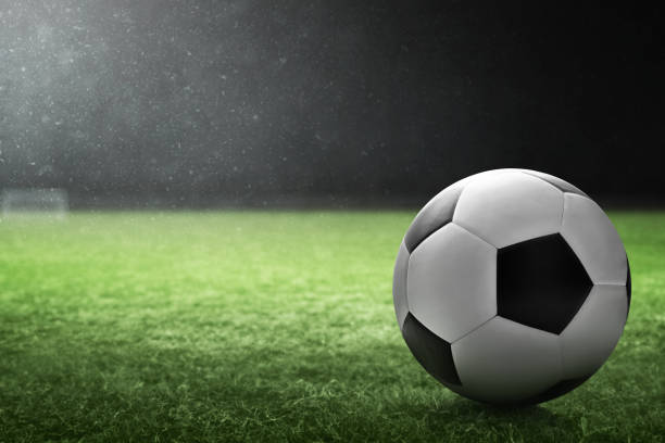 istock Soccer ball on the field 1437928564