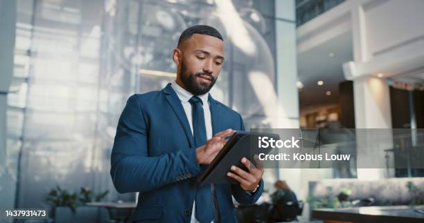 Hotel Manager And Man On A Digital Tablet For Booking Planning And Accommodation Management While Working At Front Desk Black Man Concierge And Hospitality By Male Doing Online Task At Reception Stock Photo - Download Image Now