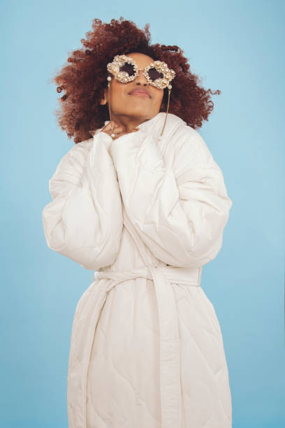 istock Cute young woman wrapped in a winter jacket 1437933089