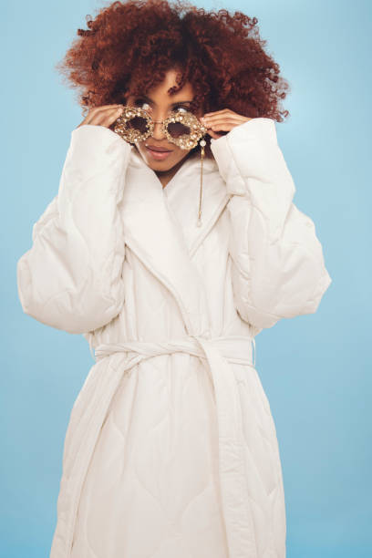 istock Cute young woman wrapped in a winter jacket 1437933095