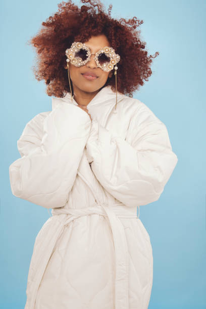 istock Cute young woman wrapped in a winter jacket 1437933100