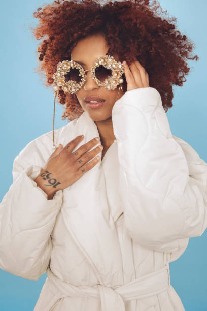 istock Cute young woman wrapped in a winter jacket 1437933157
