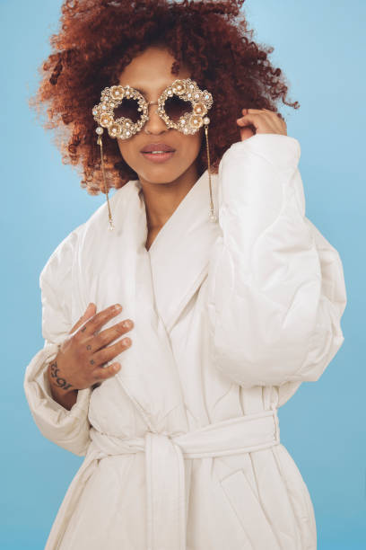istock Cute young woman wrapped in a winter jacket 1437933275