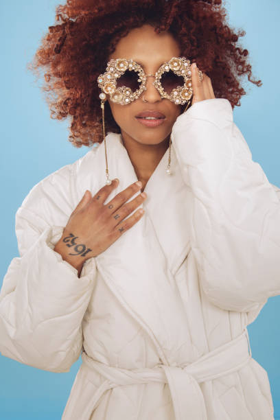 istock Cute young woman wrapped in a winter jacket 1437933309