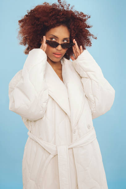 istock Cool young woman wrapped in a winter jacket 1437933790