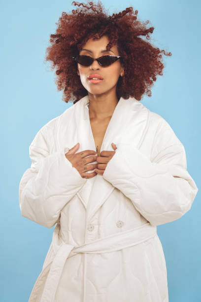 istock Cool young woman wrapped in a winter jacket 1437933818