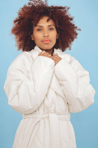 istock Beautiful woman against blue background 1437933868
