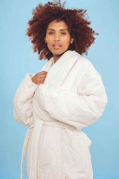 istock Beautiful woman against blue background 1437933874